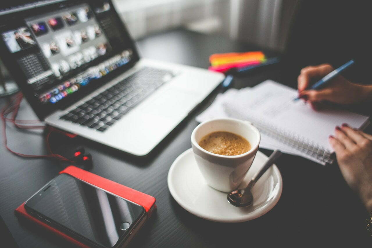 a cup of coffee and a laptop