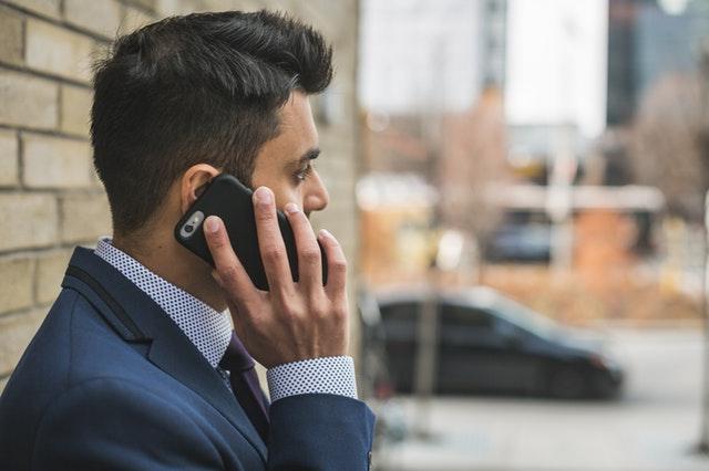 a man talking on a cell phone