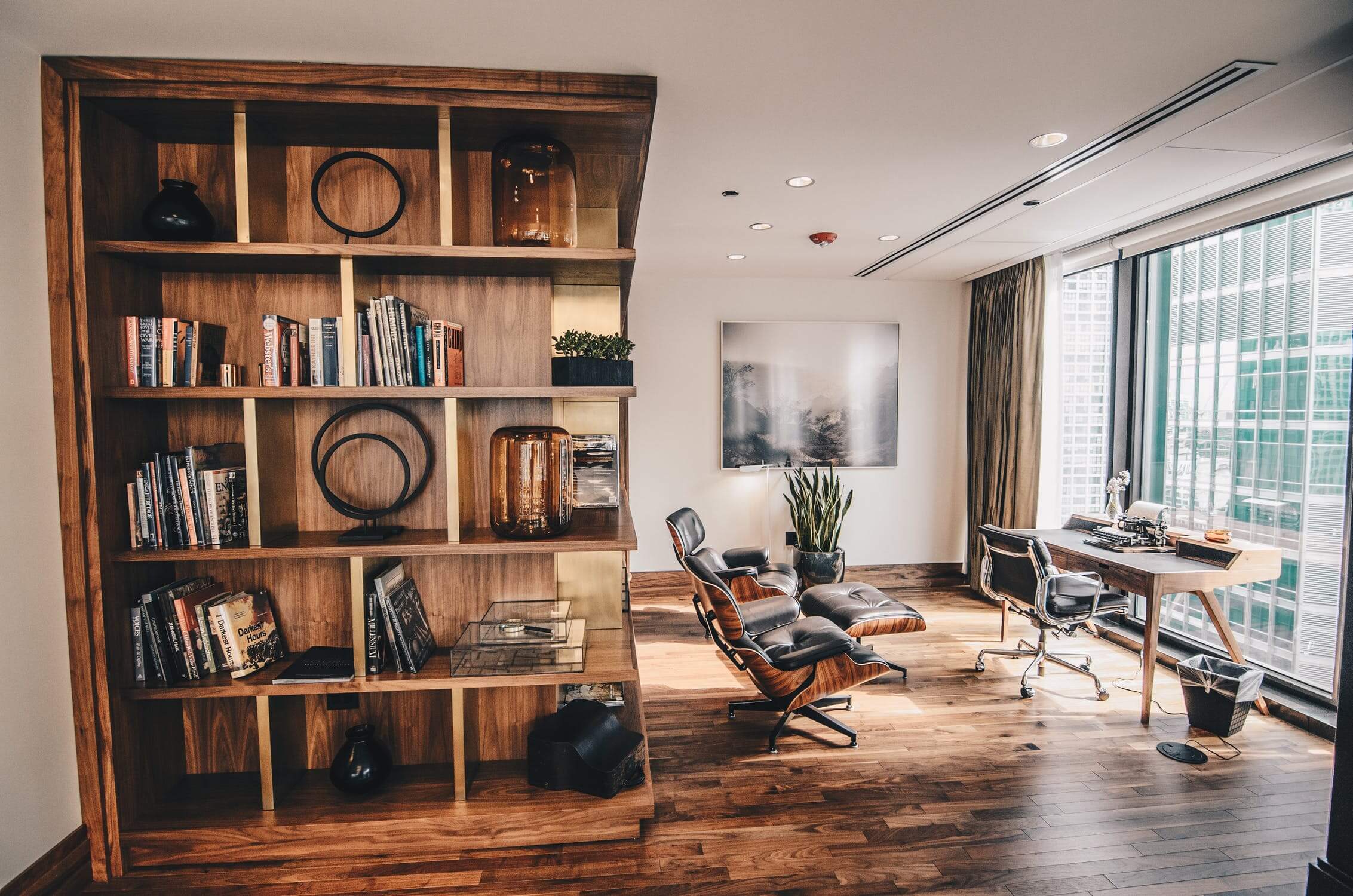 a room with a bookcase and a chair