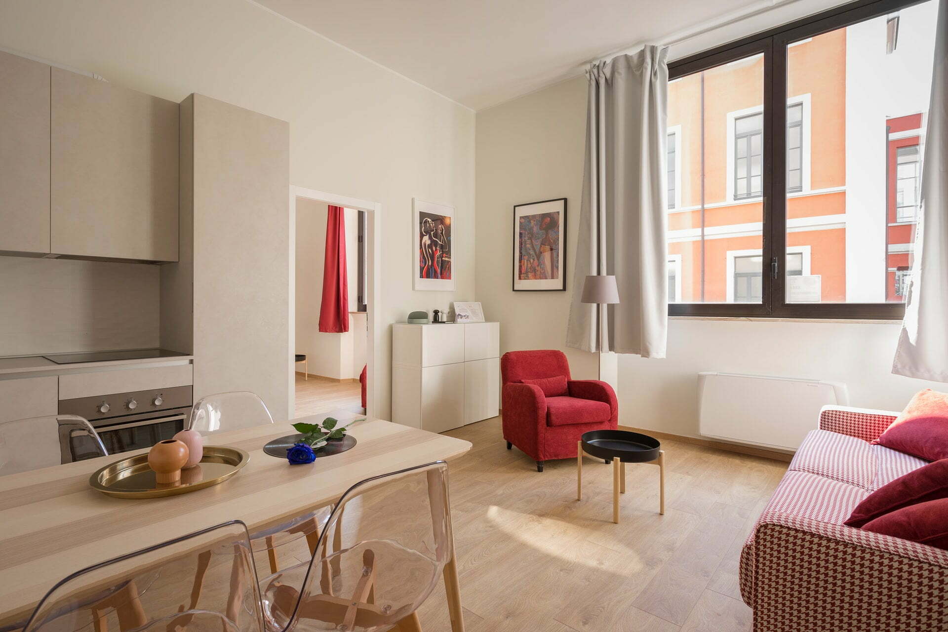 a living room with a table and chairs