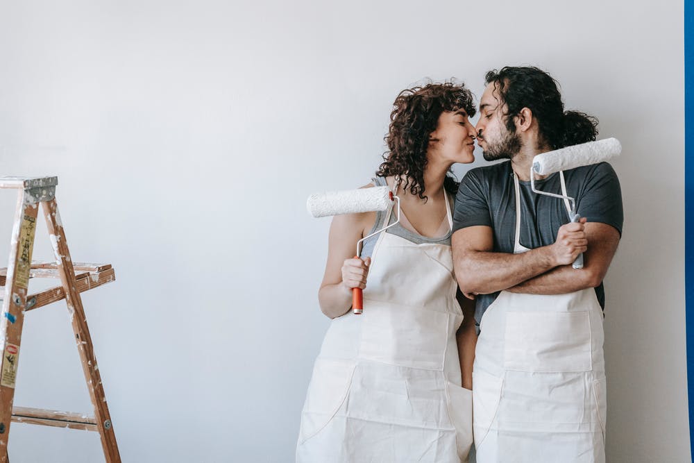 a man and woman in white lab coats holding syringes