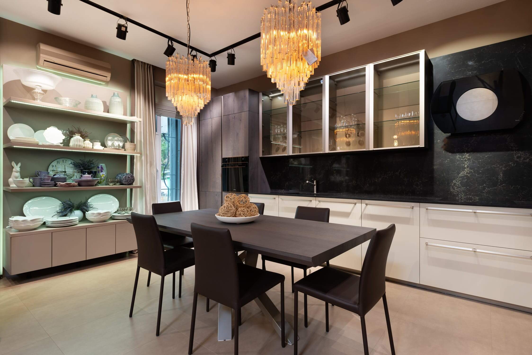 a kitchen with a table and chairs