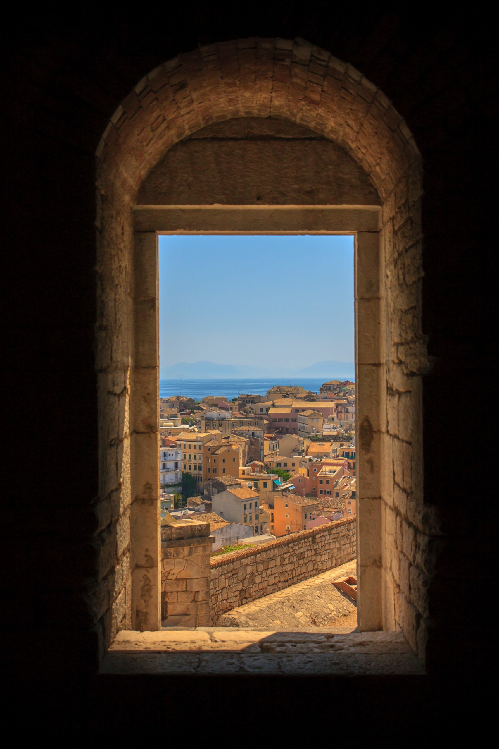 a window with a view of the city below