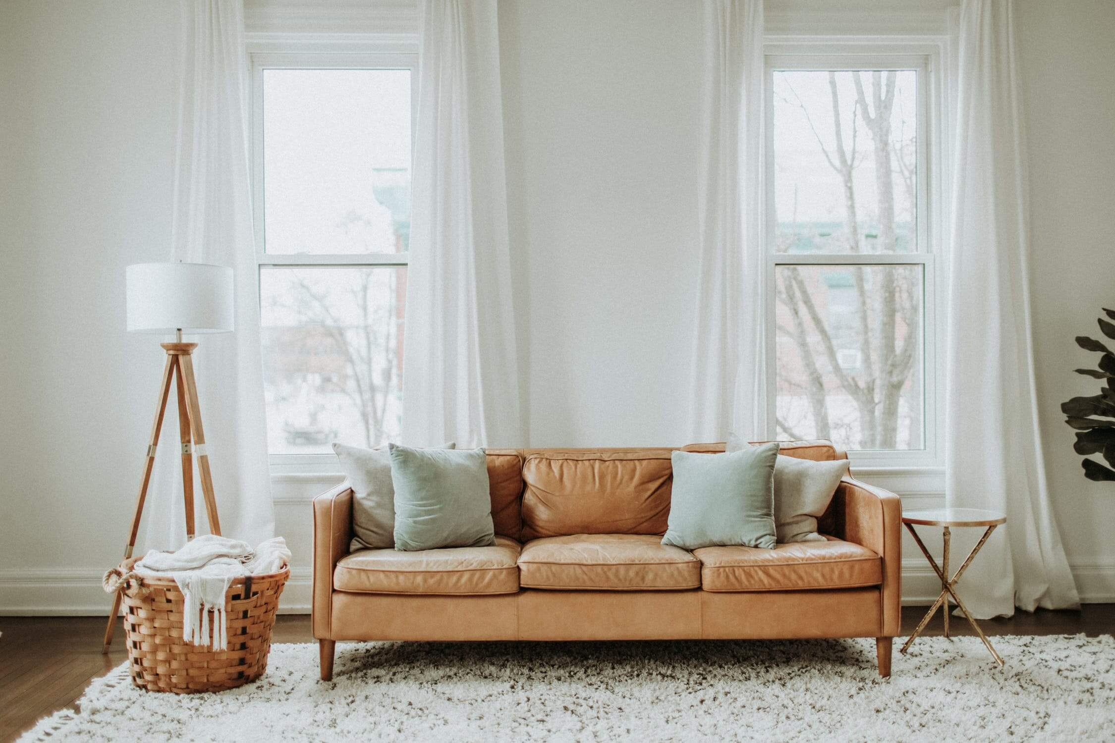 a living room with a couch and a guitar