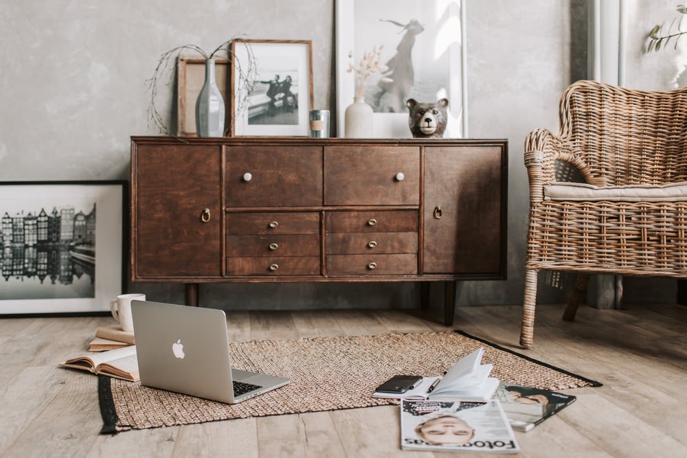 a laptop sits on a rug